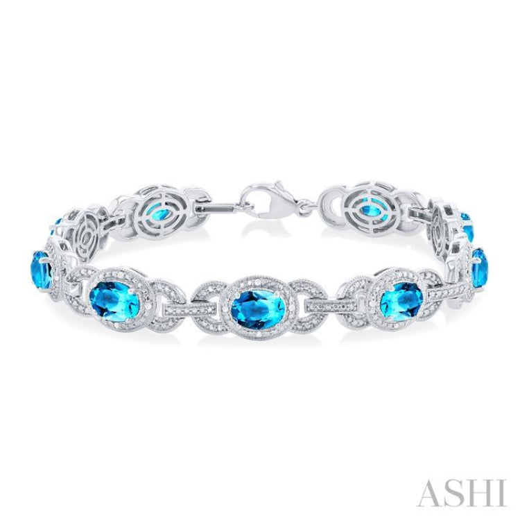 7x5 MM Oval Shape Blue Topaz and 1/10 Ctw Round Cut Diamond Semi-Precious Bracelet in Sterling Silver