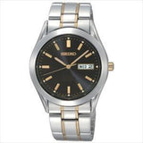 Men's Essentials
 Quartz  
Two Tone Stainless Steel Bracelet & 37mm Case  
Black Sunray Dial  
LumiBrite Hands & Markers 
Day/Date Window  
Water Resistance 100m