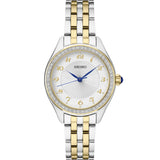 Ladies' Essentials Collection
Two-toned Stainless Steel Bracelet & 29mm Case White Dial 3 Blue Hands Swarovski Crystal Bezel Blue Cabochon Crown Water Resistance 30m