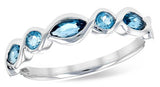 In Our Showcases dive into a sea of serenity with the Allison Kaufman Blue Topaz Ring. This delicate band of 14K white gold showcases .60ct of dazzling blue topaz stones, each nestled securely in a sleek bezel setting.