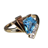 GEM/DIA RINGS & JEWE
Brand: BIJOU JEWELERS, INC.
14 Karat Yellow Gold 9X7 Blue Topaz 5 Diamonds=.08 Carat GH VS-SI Ring
