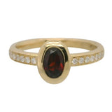 14 Karat Yellow Gold Bezel Oval Garnet 14 Diamonds= .14 Carat GH VS-SI Ring