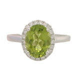 14 Karat White Gold 8X6 Peridot 21 Diamonds=.14 Carat GH VS-SI Halo Ring