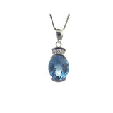 14 Karat White Gold 8X10mm Oval Checkered Blue Topaz 1/2 Bezel3 Diamonds=0.07 Carat Pendant No Chain Included
