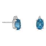 14 Karat White 5X7mm Oval Blue Topaz2 Diamonds=0.04 Carat Earrings