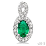 5x3 MM Oval Cut Emerald and 1/5 Ctw Round Cut Diamond Earrings in 10K White Gold